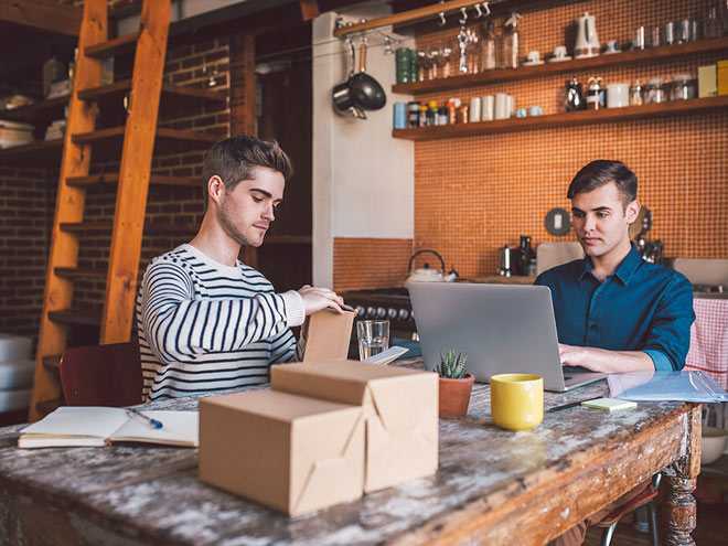 Man Writing on Laptop